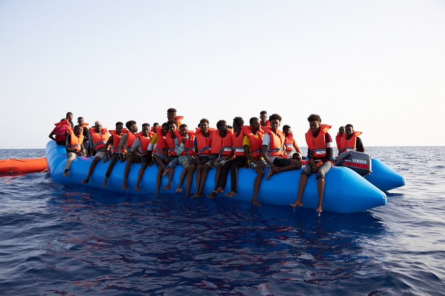 A blue inflatable boat carrying 65 people, about 34 miles from the Libyan coast according to Sea-eye, in this picture obtained from social media on July 5, 2019. Courtesy of Sea-eye/Social Media via R ...