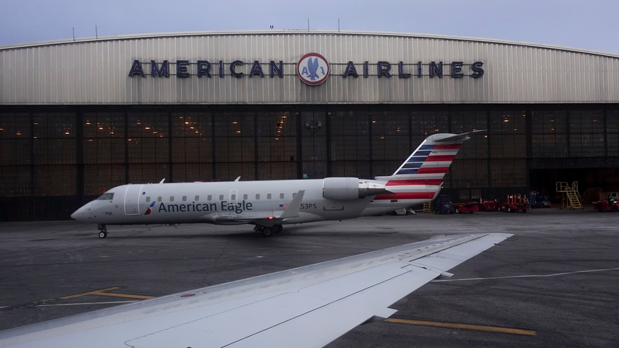 FILE- In this March 12, 2018, file photo, operations proceed outside the American Airlines facility at LaGuardia Airport in New York. American Airlines reports earns on Thursday, April 26. (AP Photo/J ...