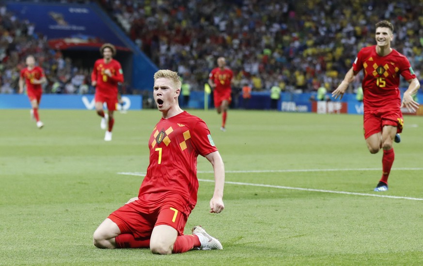 Belgium&#039;s Kevin De Bruyne, center, celebrates after scoring his side&#039;s second goal during the quarterfinal match between Brazil and Belgium at the 2018 soccer World Cup in the Kazan Arena, i ...