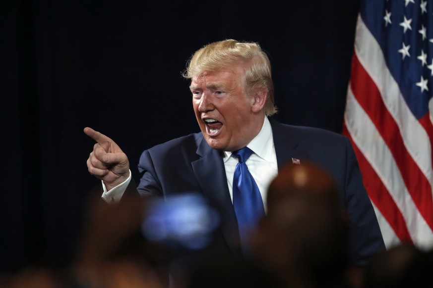 President Donald Trump gestures to an audience member after speaking at his Black Voices for Trump rally Friday, Nov. 8, 2019, in Atlanta. (AP Photo/John Bazemore)