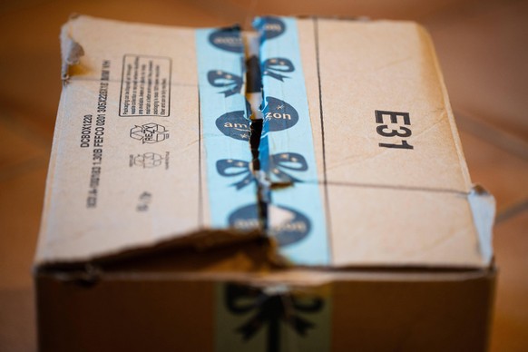 FRANCE - AMAZON PACKAGE WITH CHRISTMAS TAPE Amazon package delivered at home with christmas tape on it. Daily illustration about the consumerist society. Paris, France. Paris, France, Thursday 17 Nove ...
