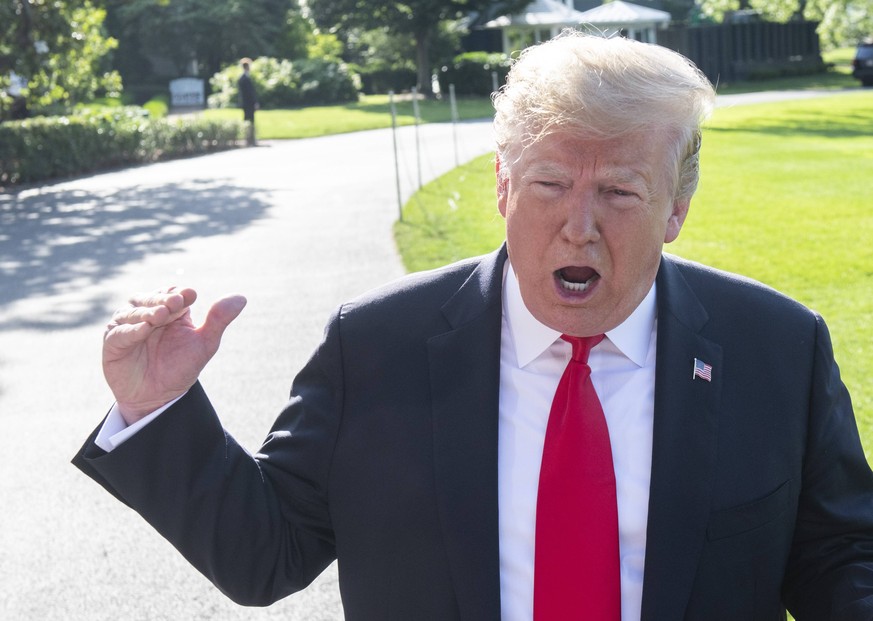 President Donald Trump reacts to a reporter s question during a press conference prior to departing via Marine One on the South Lawn of the White House in Washington, DC on May 30, 2019. The president ...