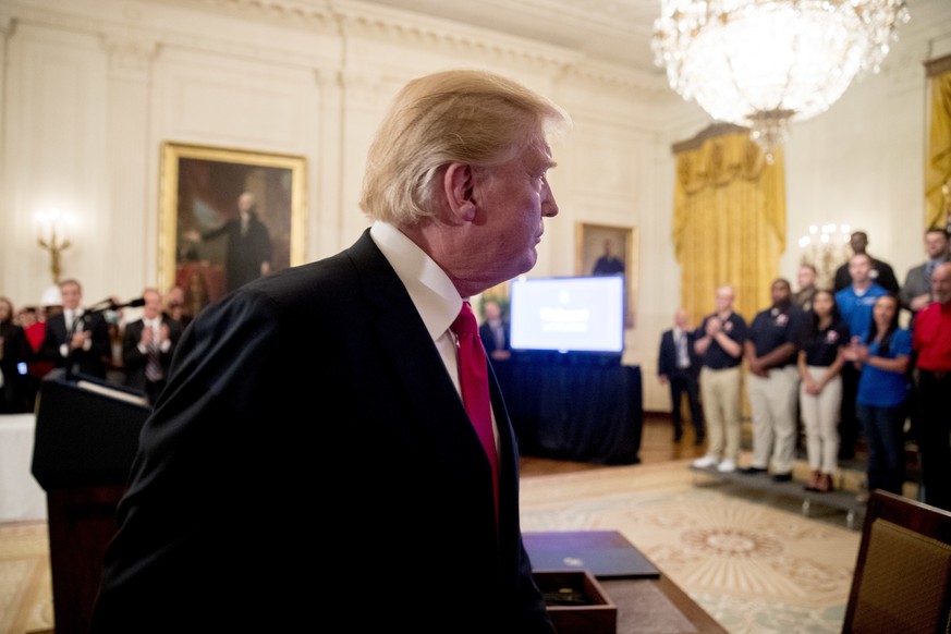 President Donald Trump departs after signing an Executive Order that establishes a National Council for the American Worker during a ceremony in the East Room of the White House, Thursday, July 19, 20 ...