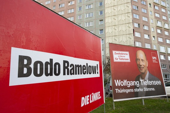 Campaign posters of the party Die Linke, left, and the Social Democratic Party, SPD, right, stand in front of a high-rise housing estate in Erfurt, Germany, Friday, Oct. 25, 2019. The words read: &#03 ...