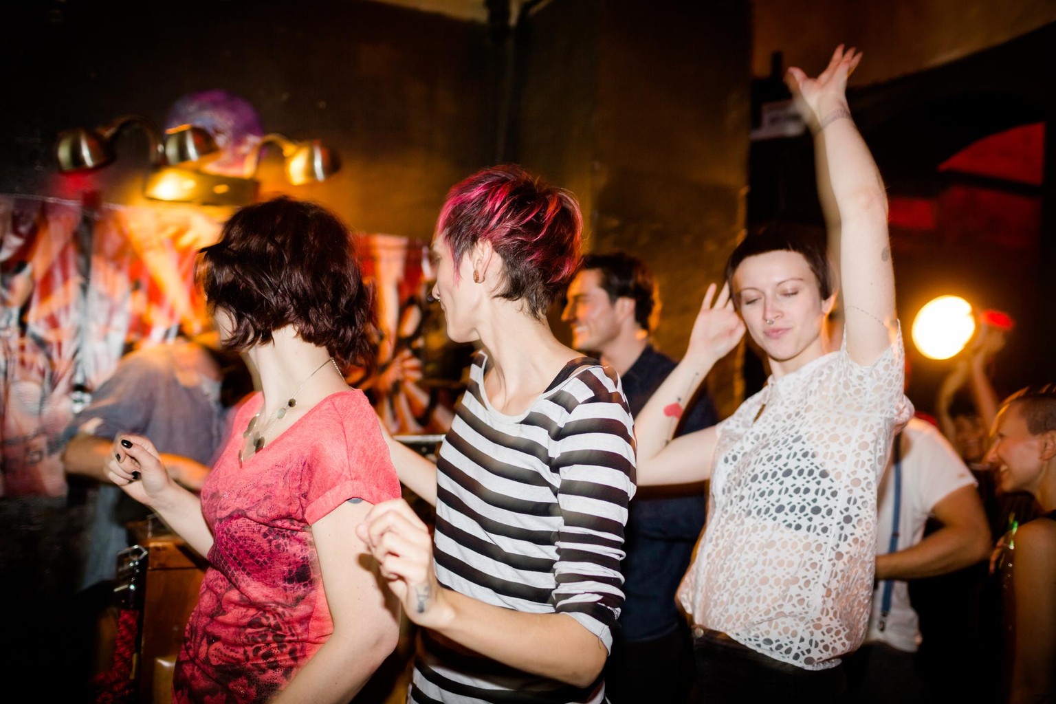 Young hip people dancing on a Berlin party.