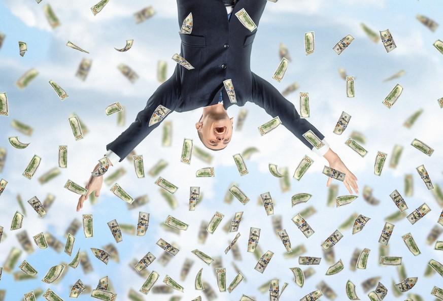 A happy businessman in a celebrating pose with loads of money in the air, all on the background of the sky. Business and finance. Succesful people. Earning money.