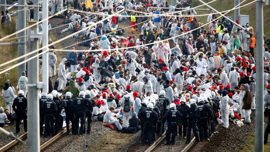 Environmental activists block a rail line as they protest for the preservation of the ancient forest &quot;Hambacher Forst&quot;, near Dueren, Germany October 27, 2018. REUTERS/Wolfgang Rattay