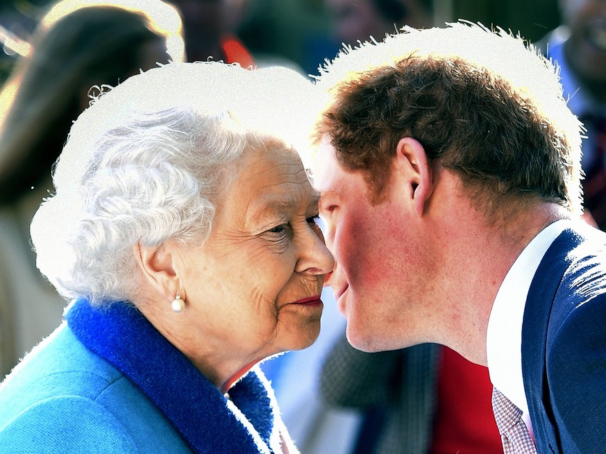 May 18, 2015 - London, GREAT BRITAIN - Britain s Queen Elizabeth greets her grandson Prince Harry at the Royal Horticultural Society Chelsea Flower Show 2015 in London Monday May 18, 2015. Horticultur ...