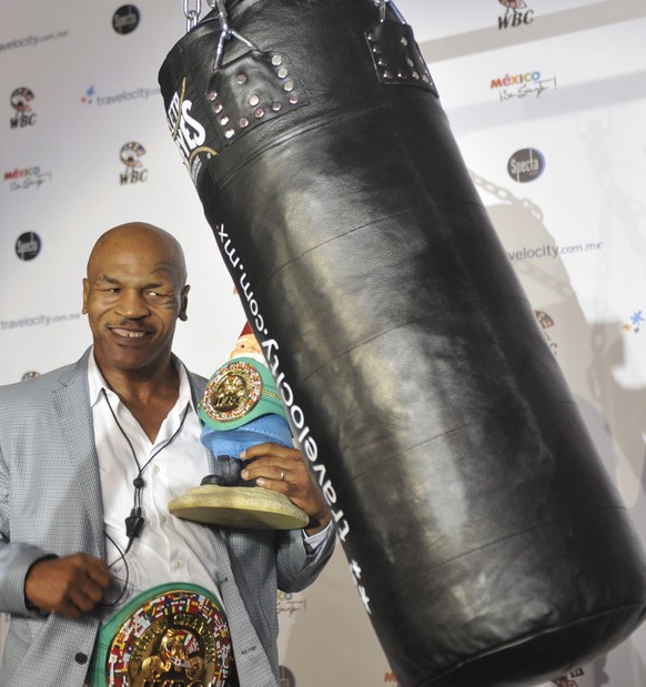 epa03305990 US former boxer, Mike Tyson, poses for a photograph during a press conference in Mexico City, on 13 July 2012. Tyson said he would like to continue in boxing but has not been given an oppo ...
