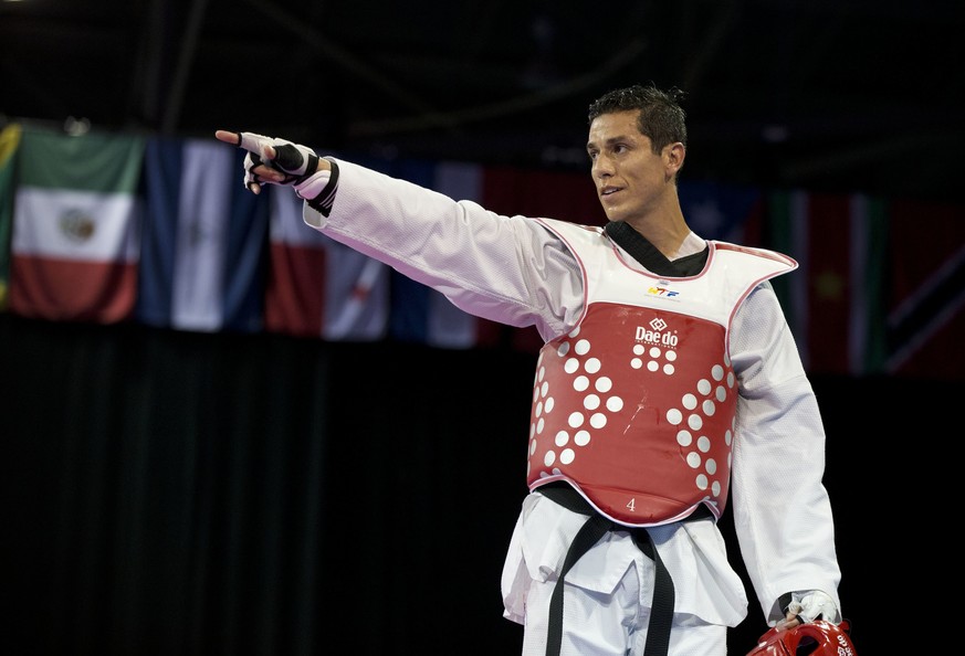FILE - In this July 21, 2015 file photo, United States&#039; Steven Lopez celebrates winning a bronze medal by defeating Venezuela&#039;s Javier Medina in the men&#039;s taekwondo under-80kg category  ...