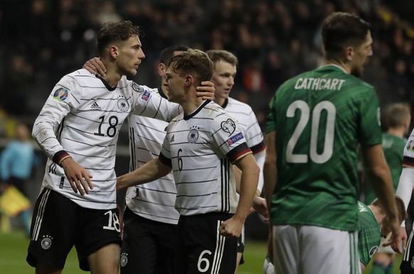 Germany&#039;s Leon Goretzka, left, with his teammate Joshua Kimmich, celebrates his goal against Northern Ireland during a Group C soccer qualifying match between Germany and Northern Ireland at the  ...