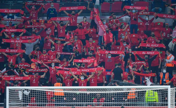 210209 -- DOHA, Feb. 9, 2021 -- Supporters of Al Ahly cheer for the team during the FIFA Club World Cup semi-final football match between Egypt s Al Ahly and Germany s Bayern Munich at Ahmad Bin Ali S ...