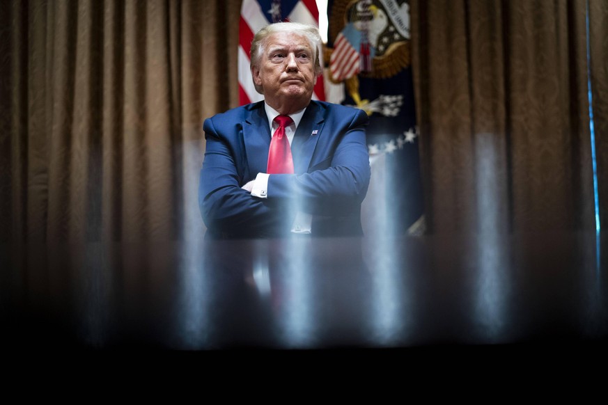 President Donald Trump makes remarks as is surrounded by African-American supporters in the Cabinet Room of the White House in Washington, DC on Tuesday, June, 10, 2020. Trump held the meeting as part ...