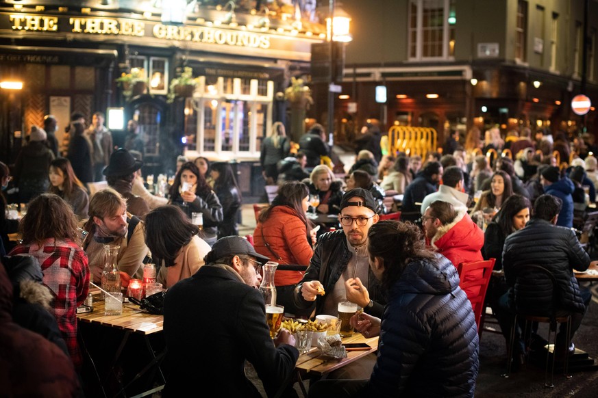 Coronavirus - Mon Apr 12, 2021 People gather in Soho, London, where streets were closed to traffic as bars and restaurants opened for outside eating and drinking, as lockdown measures are eased across ...