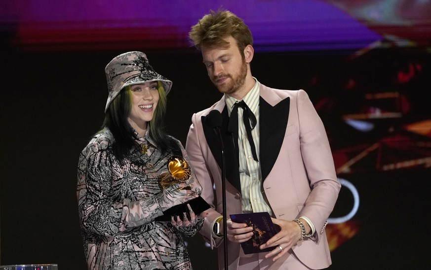 Billie Eilish, left, and Finneas accept the award for record of the year for &quot;Everything I Wanted&quot; at the 63rd annual Grammy Awards at the Los Angeles Convention Center on Sunday, March 14,  ...