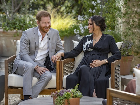 This image provided by Harpo Productions shows Prince Harry, left, and Meghan, Duchess of Sussex, speaking about expecting their second child during an interview with Oprah Winfrey. &quot;Oprah with M ...