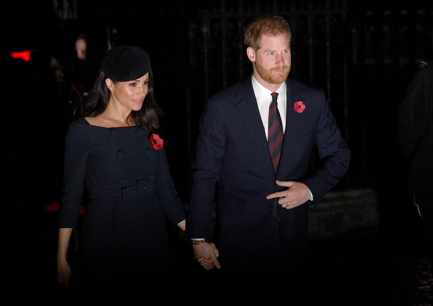 LONDON, ENGLAND - NOVEMBER 11: Prince Harry, Duke of Sussex and Meghan, Duchess of Sussex attend a service marking the centenary of WW1 armistice at Westminster Abbey on November 11, 2018 in London, E ...