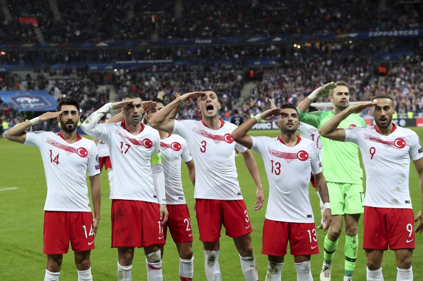 Turkey&#039;s players salute as they celebrated a goal against France during the Euro 2020 group H qualifying soccer match between France and Turkey at Stade de France at Saint Denis, north of Paris,  ...