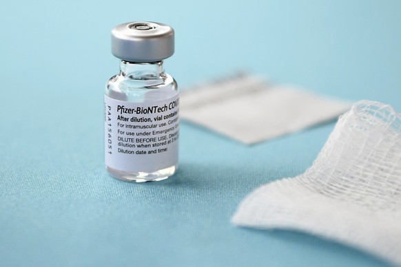 FILE - In this Monday, Dec. 14, 2020, file photo, a vial of the Pfizer-BioNTech vaccine for COVID-19 sits on a table at Hartford Hospital in Hartford, Conn. New research suggests that Pfizer’s COVID-1 ...