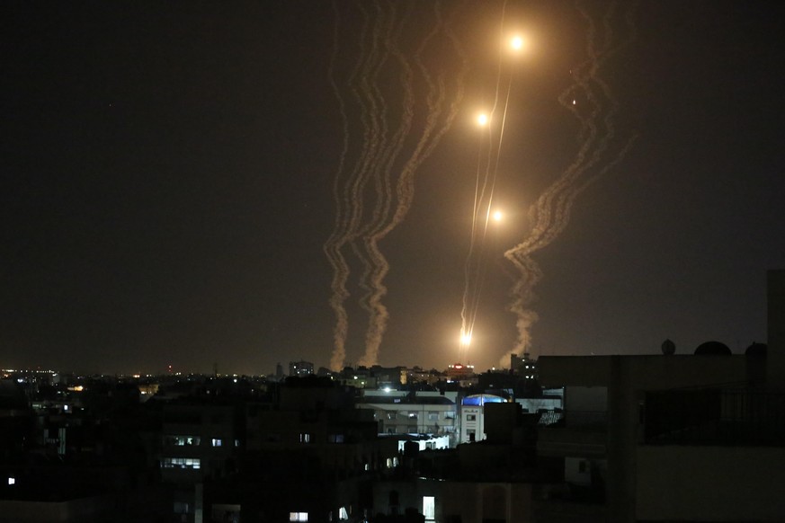 May 12, 2021, Gaza City, Gaza Strip, Palestinian Territory: Rockets are fired from Gaza City, towards Israel light up the night sky. At least 65 people in Gaza, including 14 children, and seven people ...