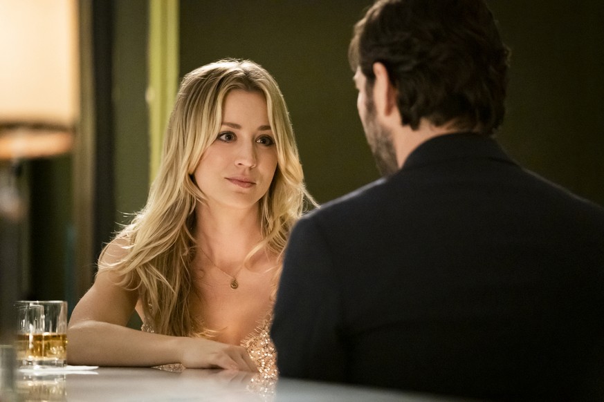 This image released by HBO Max shows Kaley Cuoco, left, and Michiel Huisman in a scene from &quot;The Flight Attendant.&quot; Cuoco was nominated for a Golden Globe for best actress in a comedy or mus ...
