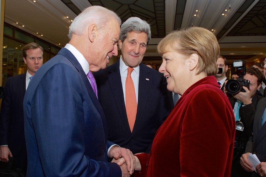 Feb. 7, 2015 - Munich, Germany - U.S. Vice President Joe Biden and Secretary of State John Kerry greet German Chancellor Angela Merkel on the sidelines of the Munich Security Conference February 7, 20 ...