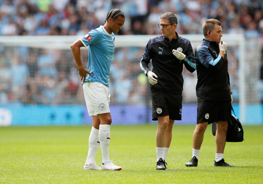 Soccer Football - FA Community Shield - Manchester City v Liverpool - Wembley Stadium, London, Britain - August 4, 2019 Manchester City&#039;s Leroy Sane is substituted after sustaining an injury REUT ...