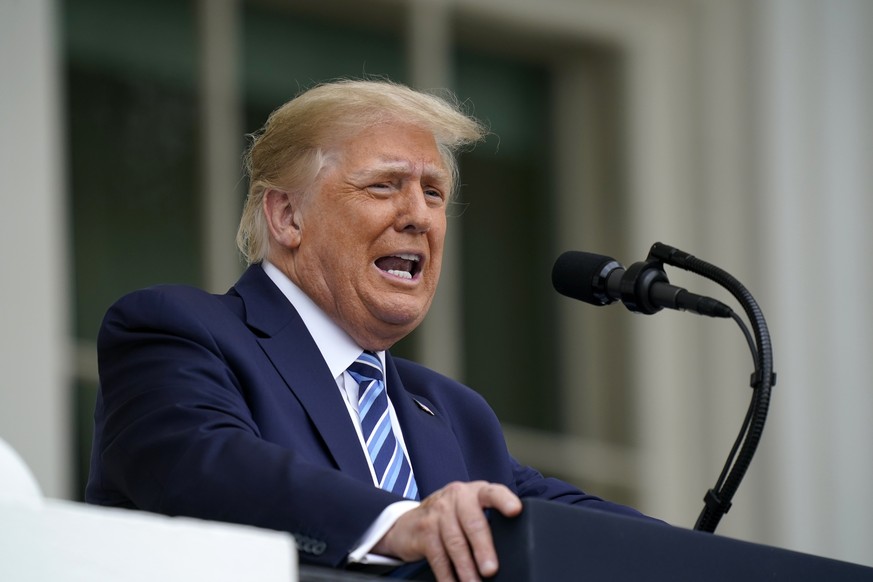 FILE - In this Oct. 10, 2020, file photo, President Donald Trump speaks from the Blue Room Balcony of the White House to a crowd of supporters in Washington. (AP Photo/Alex Brandon, File)