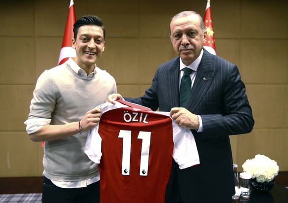 In this photo taken on Sunday, May 13, 2018, Turkey&#039;s President Recep Tayyip Erdogan, right, poses for a photo with Turkish-German Arsenal soccer player Mesut Ozil in London. Erdogan started a th ...