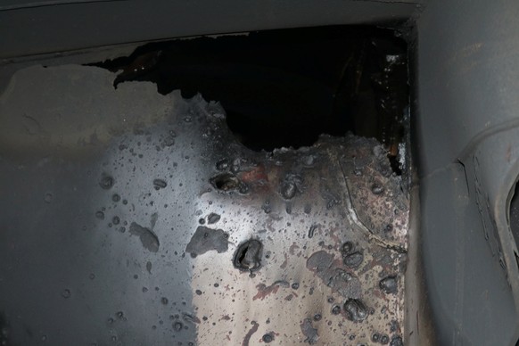 A U.S. military image released by the Pentagon in Washington on June 17 shows what the Pentagon says is a view of internal hull penetration and blast damage sustained from a limpet mine attack on the  ...