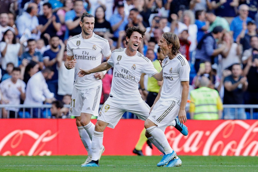 October 5, 2019, Madrid, Madrid, Spain: L-R Gareth Bale, Alvaro Odriozola and Luka Modric of Real Madrid celebrate goal during La Liga match between Real Madrid and Granada CF at Santiago Bernabeu Sta ...