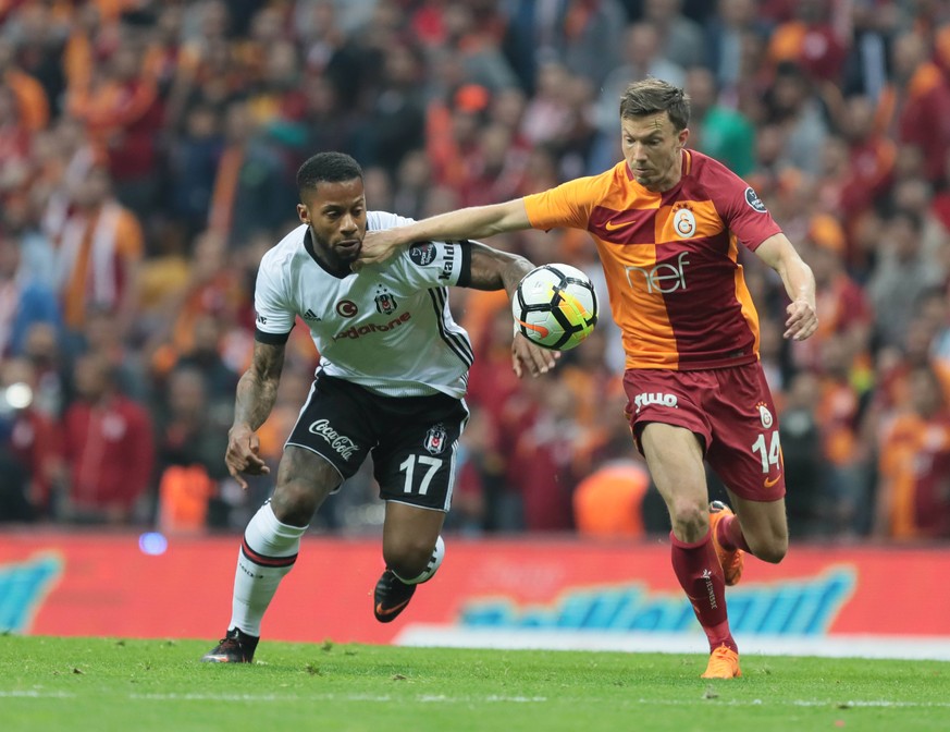 Martin Linnes (R) of Galatasaray and Jeremain Lens of Besiktas during the Turkish Superlig Derby match between Galatasaray and Besiktas at Turk Telekom Arena Stadium in Istanbul , Turkey on April 29 , ...