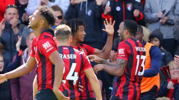 BOURNEMOUTH, ENGLAND - MAY 04: Nathan Ake of AFC Bournemouth celebrates with teammates after scoring his team&#039;s first goal during the Premier League match between AFC Bournemouth and Tottenham Ho ...