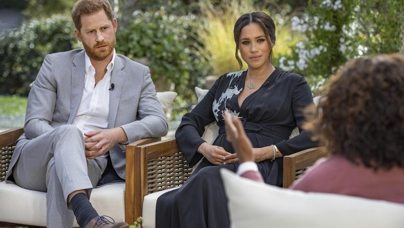 This image provided by Harpo Productions shows Prince Harry, from left, and Meghan, The Duchess of Sussex, in conversation with Oprah Winfrey. “Oprah with Meghan and Harry: A CBS Primetime Special” ai ...