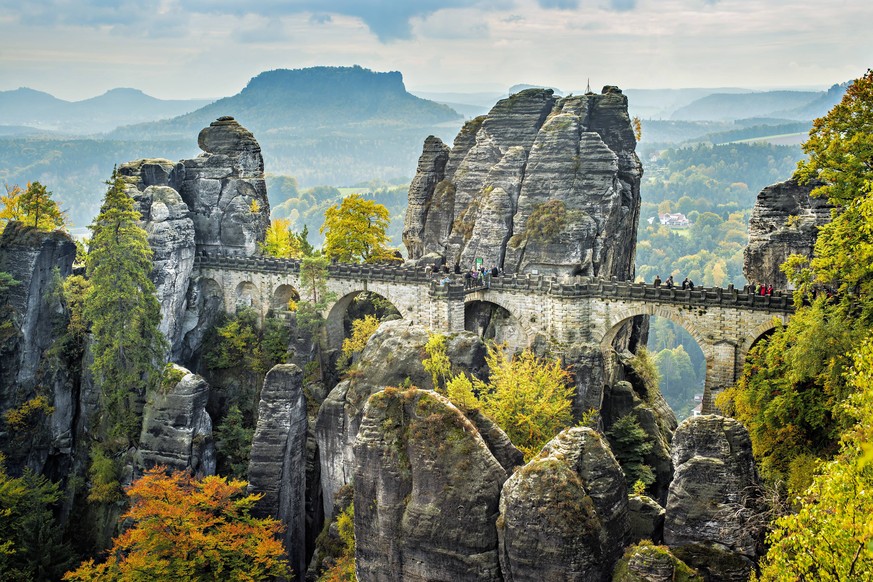 Bridge named Bastei in Saxon Switzerland Bridge named Bastei in Saxon Switzerland Germany on a sunny day in autumn with colored trees and leafs