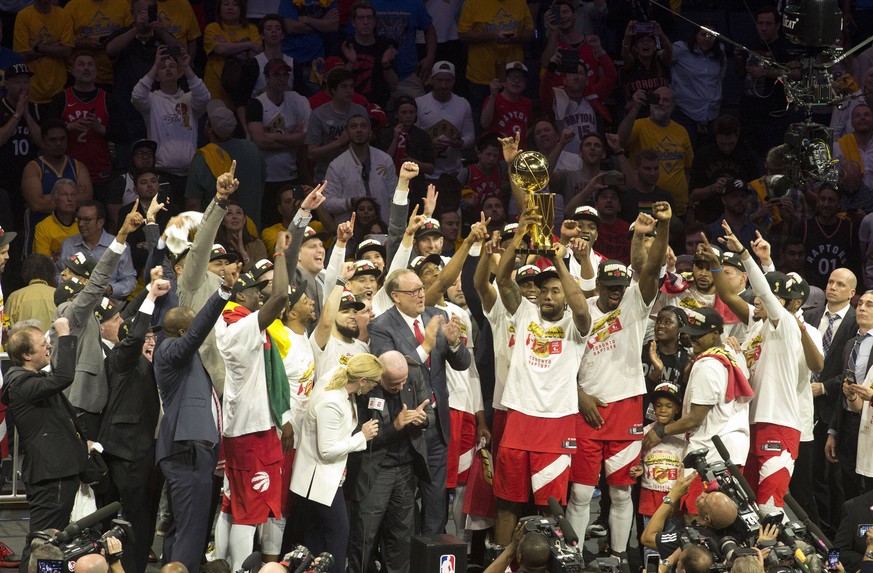 June 13, 2019 - Oakland, California, USA - The Toronto Raptors celebrates with the Larry O Brien Championship Trophy after his team defeated the Golden State Warriors to win Game Six of the 2019 NBA,  ...
