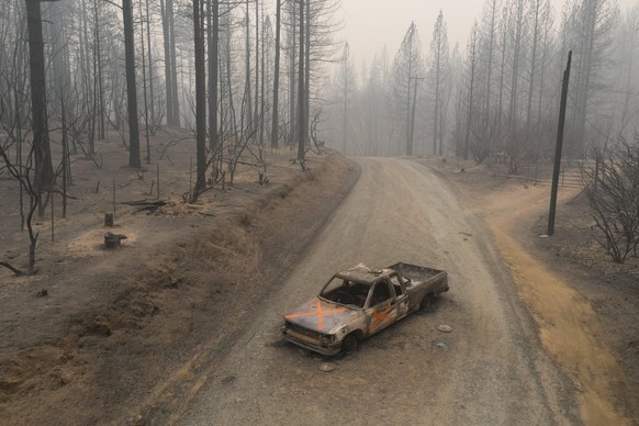 September 10, 2020, Berry Creek, California, USA: A burned out truck sits on Graystone Lane after the Bear Fire near Lake Oroville in Northern California. Three people have now been found dead in the  ...