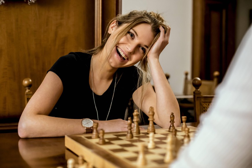 Woman having fun playing chess model released Symbolfoto property released PUBLICATIONxINxGERxSUIxAUTxHUNxONLY ACPF00436