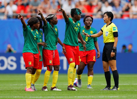 Soccer Football - Women&#039;s World Cup - Round of 16 - England v Cameroon - Stade du Hainaut, Valenciennes, France - June 23, 2019 Cameroon&#039;s Gaelle Enganamouit, Raissa Feudjio and team mates r ...