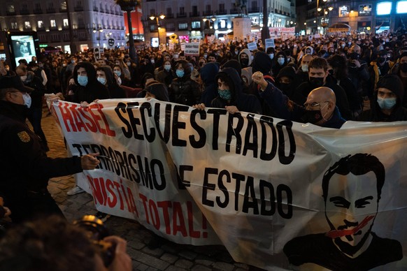 Protesters throw stones towards the the police officers during the demonstration. Pablo Hasl, a Catalan rapper, was arrested on a Tuesday morning, February 16 and was sentenced to nine months and one  ...