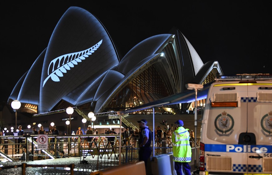 SYDNEY, AUSTRALIA - MARCH 16: A police check point outside the opera House as a silver fern is projected onto the sails in commemoration of the victims of the Christchurch massacre on March 16, 2019 i ...