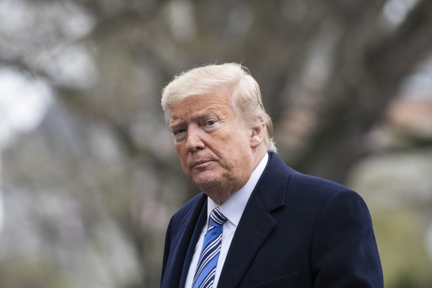 President Donald Trump walks from Marine One as he returns to the White House, Saturday, March 28, 2020, in Washington. Trump is returning from Norfolk, Va., for the sailing of the USNS Comfort, which ...