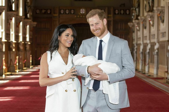 FILE - In this Wednesday May 8, 2019 file photo Britain&#039;s Prince Harry and Meghan, Duchess of Sussex, pose during a photocall with their newborn son Archie, in St George&#039;s Hall at Windsor Ca ...