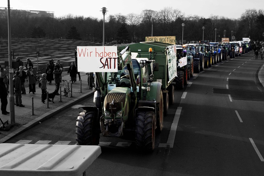 BERLIN, GERMANY - JANUARY 19: Farmers&#039; tractors participate in a protest march over agricultural policy on January 19, 2019 in Berlin, Germany. Thousands of people participated in the march to pr ...