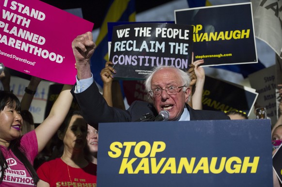 Sen. Bernie Sanders, I-Vt., speaks with protesters in front of the Supreme Court in Washington, Monday, July 9, 2018, after President Donald Trump announced Judge Brett Kavanaugh as his Supreme Court  ...