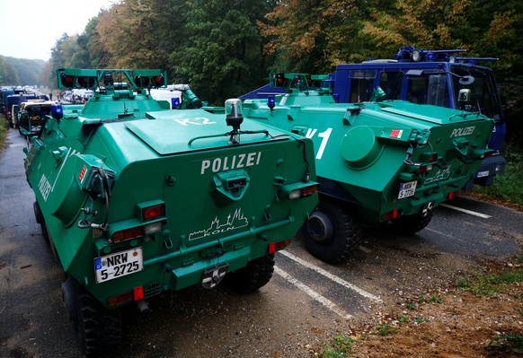 Police armoured vehicles and a water cannon are seen at the site as police prepares to clear the area at the &quot;Hambacher Forst&quot; in Kerpen-Buir near Cologne, Germany, September 13, 2018, where ...