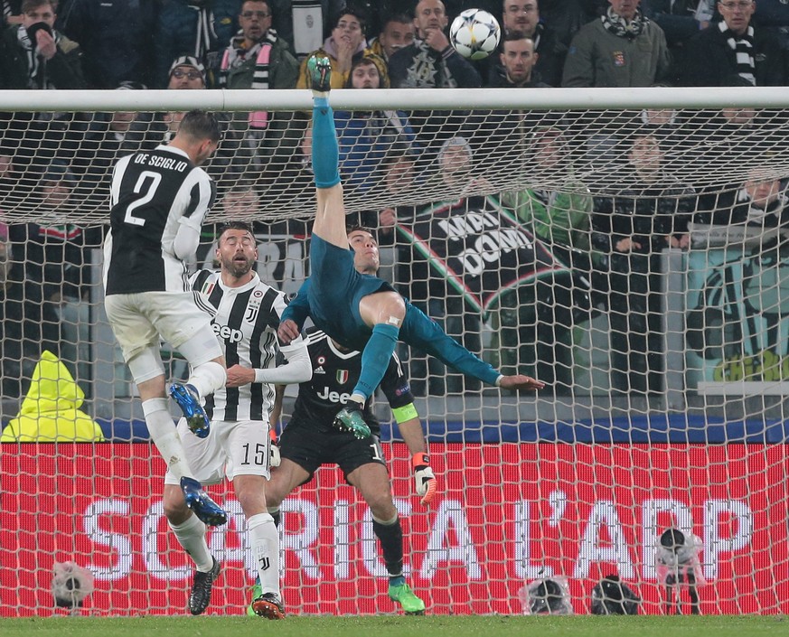 TURIN, ITALY - APRIL 03: Cristiano Ronaldo of Real Madrid scores his sides second goal during the UEFA Champions League Quarter Final Leg One match between Juventus and Real Madrid at Allianz Stadium  ...
