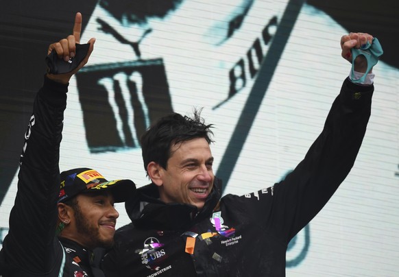 Mercedes driver Lewis Hamilton of Britain, left, celebrates with Mercedes team principal Toto Wolff on the podium after winning the Turkish Formula One Grand Prix at the Istanbul Park circuit racetrac ...