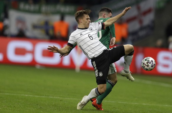 Germany&#039;s Joshua Kimmich, front, fights for the ball with Northern Ireland&#039;s Jordan Thompson during the Group C soccer qualifying match between Germany and Northern Ireland at the Commerzban ...