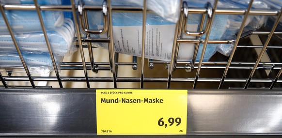 A price tag advertising protective masks is seen at the food discounter ALDI, as the spread of coronavirus disease (COVID-19) continues in Duesseldorf, Germany, April 29, 2020. REUTERS/Wolfgang Rattay